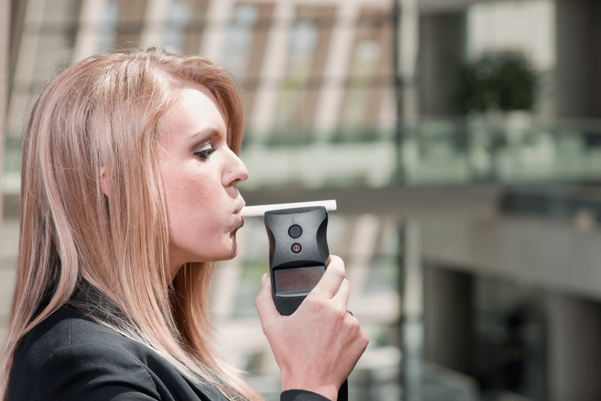 woman using a breathalizer