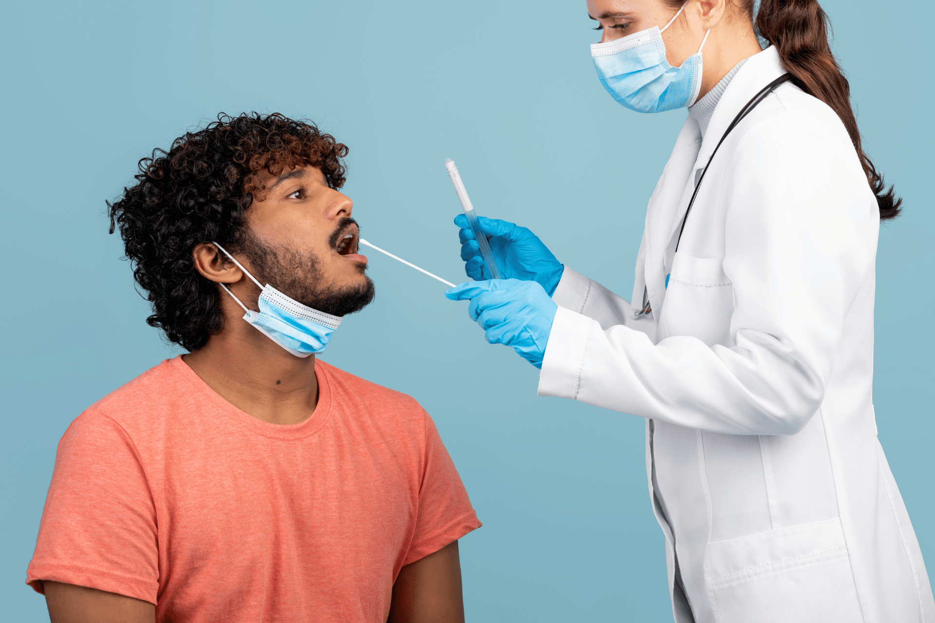 doctor taking oral fluid from patient