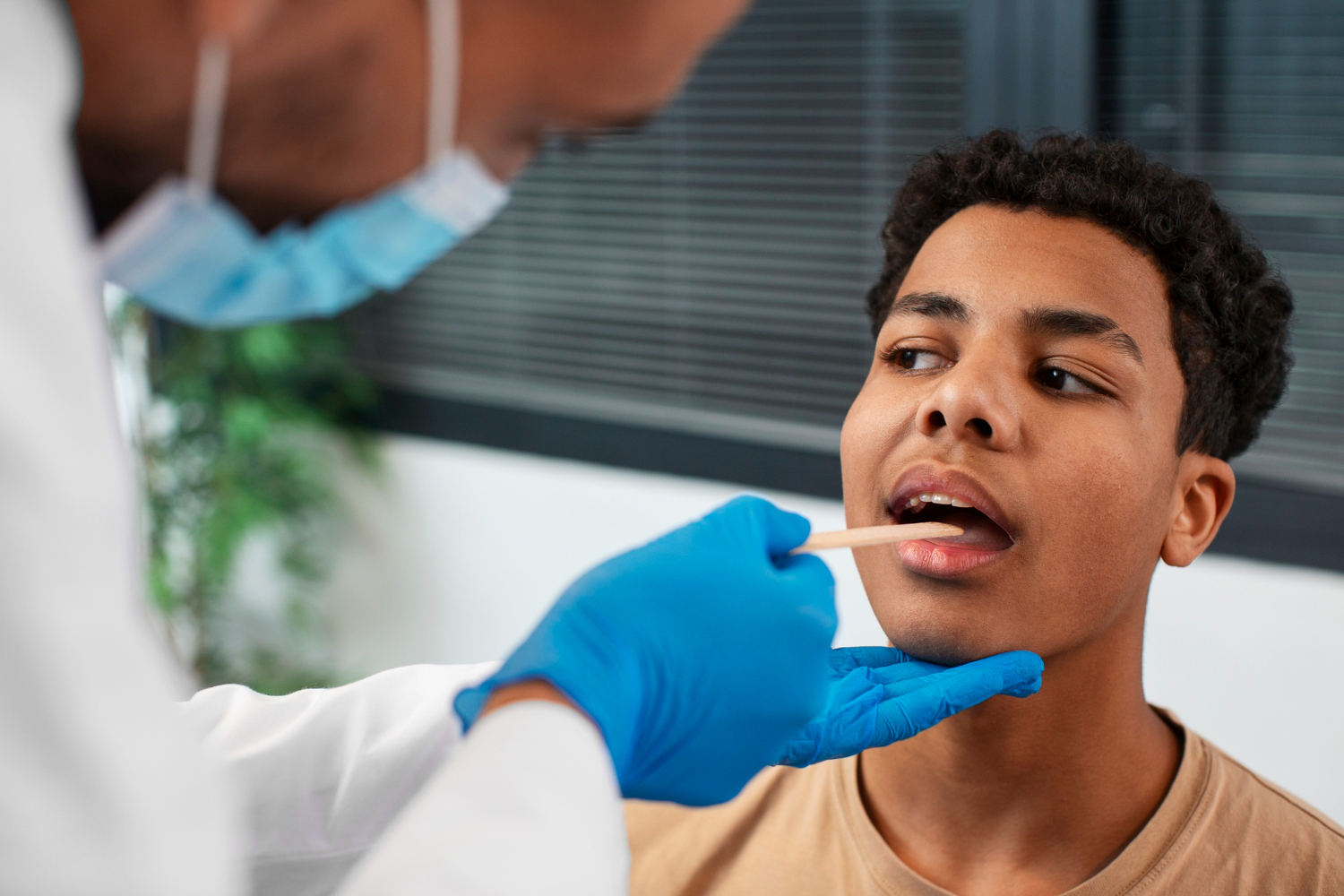 Healthcare professional administering a saliva drug test to a young man during workplace screening.