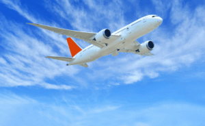 Commercial airplane in flight representing FAA drug and alcohol testing requirements for pilots, flight crews, and safety-sensitive aviation personnel